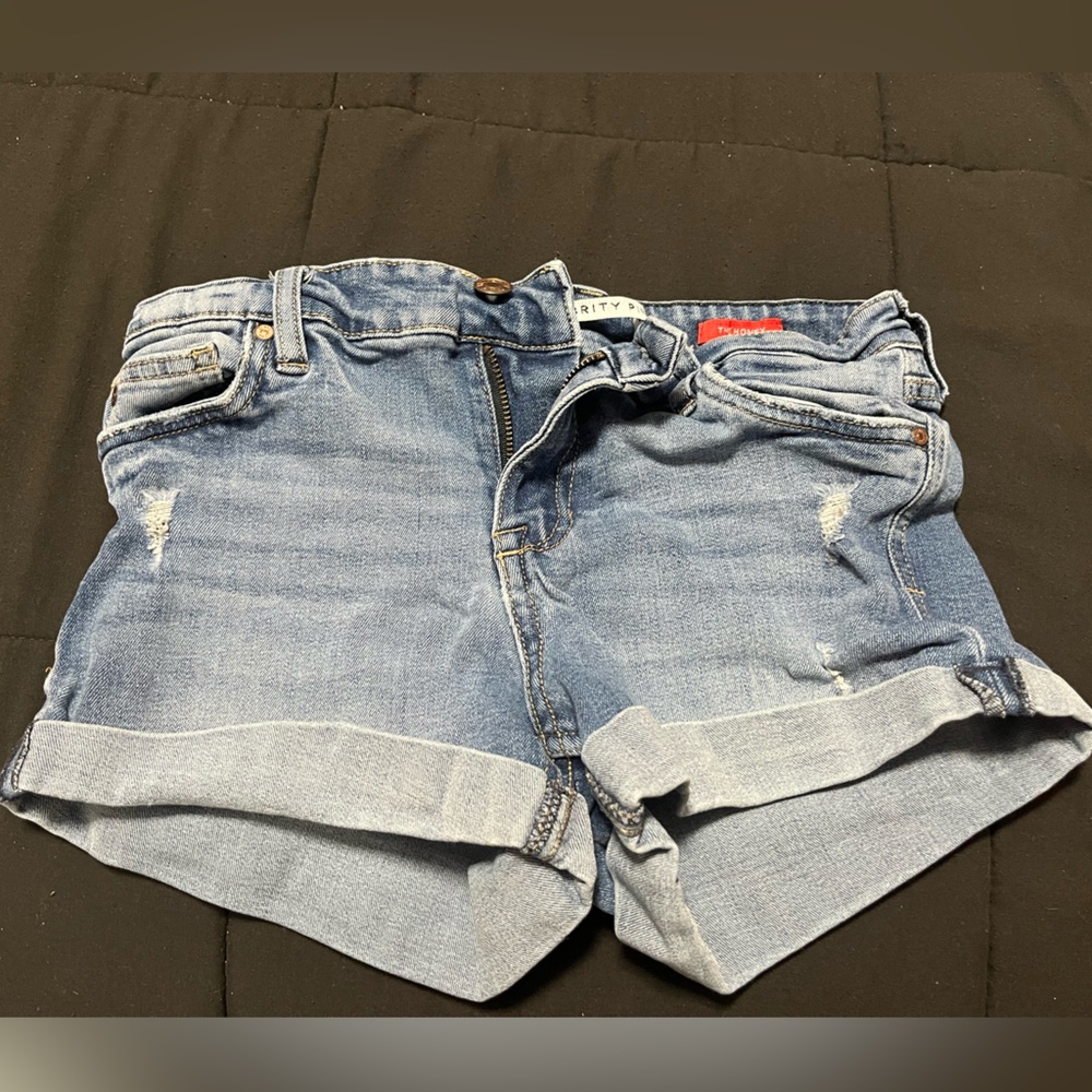 Women’s Jean shorts with slights rips.